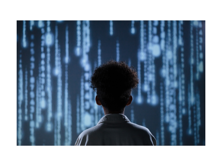 Image of a young person facing a waterfall-like representation of a digital future