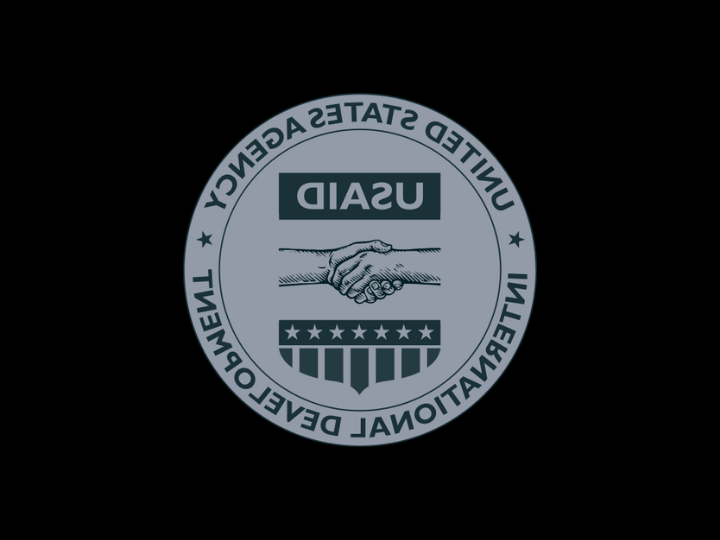 a reversed negative version of the USAID logo