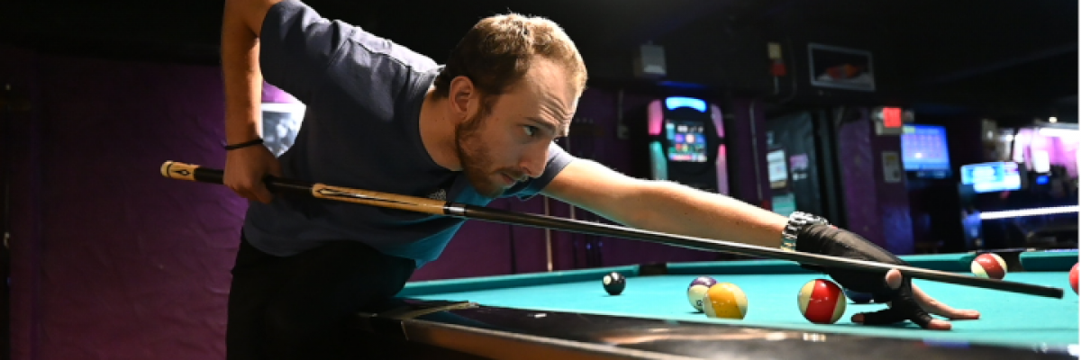 Ex-pool shark Aidan Lees, 25, in the final round of the Monday night tournament at Pockets Billiards Club in East Boston. Photo by Bryan Liu. Copyright 2023 Bryan Liu.